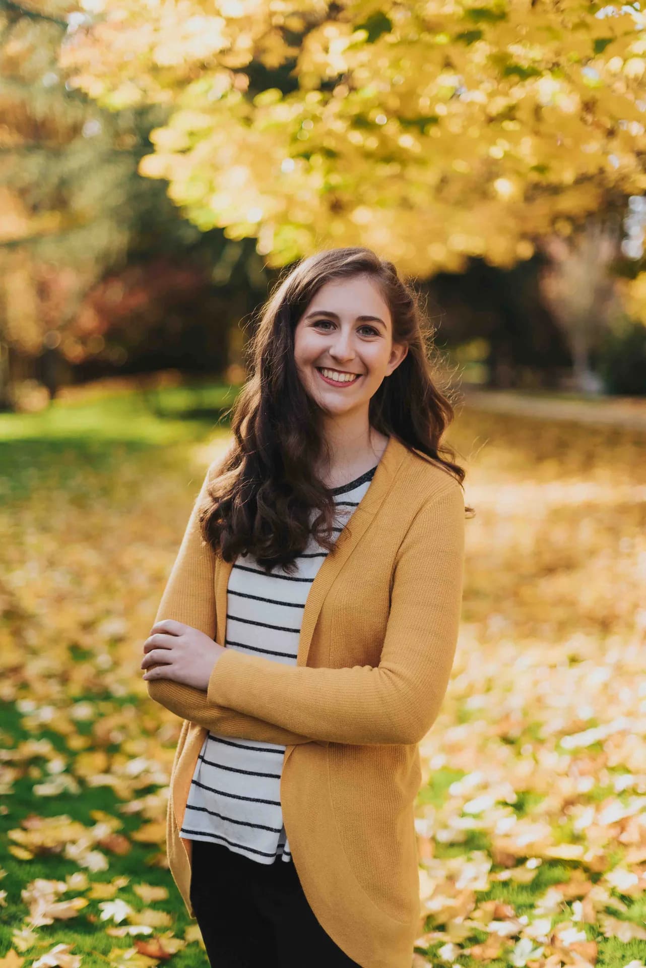 Lauren smiling in warm autumn light